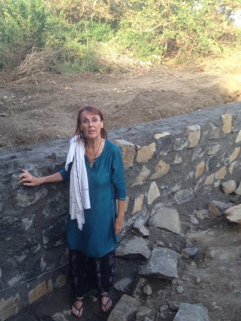 Shazar standing by the dam wall